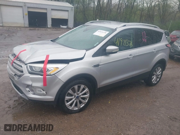 2017 Ford Escape Titanium with VIN 1FMCU0J96HUC21987, listed as a IAAI auction lot 41971376 with 97,488 mi miles and . Bid and sale history available at DreamBid. Image 2.