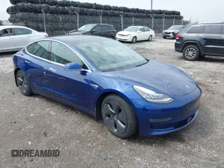 2019 Tesla Model 3 Long Range with VIN 5YJ3E1EB5KF497582, listed as a IAAI auction lot 42019402 with 118,113 mi miles. Bid and sale history available at carsss.com. Image 1.