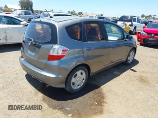 2013 Honda Fit z VIN JHMGE8H34DC082914, wystawiony jako IAAI lot #42288271 z przebiegiem 186 269 mil mil oraz . Historia ofert i sprzedaży dostępna na DreamBid. Obrazek 4.