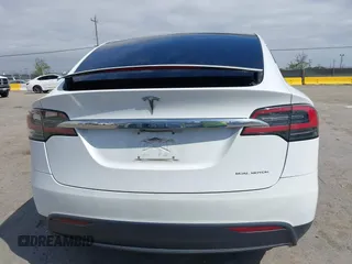2021 Tesla Model X Long Range Plus with VIN 5YJXCBE23MF321243, listed as a IAAI auction lot 42100580 with 59,878 mi miles and . Bid and sale history available at carsss.com. Image 16.