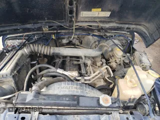 2000 Jeep Wrangler Sport with VIN 1J4FA49S0YP770943, listed as a Copart auction lot 68615524 with 165,377 mi miles and Salvage Title. Bid and sale history available at carsss.com. Image 11.