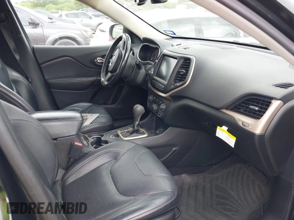 2014 Jeep Cherokee Limited with VIN 1C4PJLDS8EW104085, listed as a IAAI auction lot 42104059 with 141,951 mi miles and . Bid and sale history available at DreamBid. Image 5.