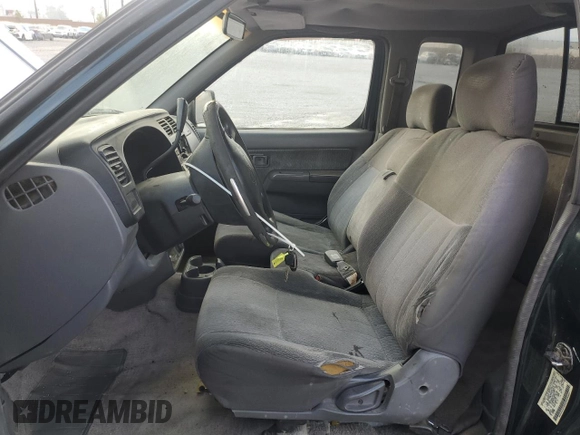 1999 Nissan Frontier XE with VIN 1N6DD26S6XC332458, listed as a Copart auction lot 48028715 with 182,706 mi miles and Salvage title. Bid and sale history available at DreamBid. Image 7.