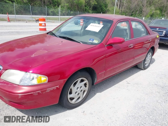 2000 Mazda 626 LX with VIN 1YVGF22C8Y5115891, listed as a IAAI auction lot 42121137 with 186,165 mi miles. Bid and sale history available at carsss.com. Image 2.