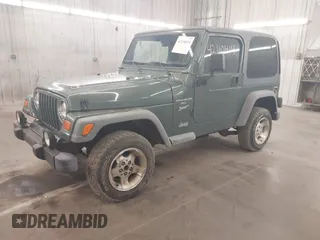 1999 Jeep Wrangler Sport with VIN 1J4FY19S0XP496555, listed as a IAAI auction lot 42110414 with 125,500 mi miles. Bid and sale history available at carsss.com. Image 2.