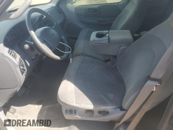 2001 Ford F-150 XL with VIN 1FTRX18L71NA27627, listed as a Copart auction lot 64190715 with 105,503 mi miles and Salvage title. Bid and sale history available at DreamBid. Image 7.