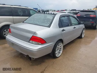 2003 Mitsubishi Lancer ES with VIN JA3AJ26E43U038813, listed as a IAAI auction lot 41778956 with 150,764 mi miles. Bid and sale history available at carsss.com. Image 4.