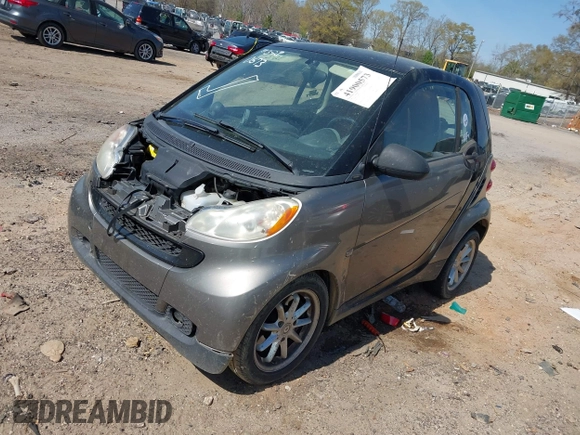 2009 Smart fortwo Pure z VIN WMEEJ31X99K302227, wystawiony jako IAAI lot #41900573 z przebiegiem 30 730 mil mil oraz . Historia ofert i sprzedaży dostępna na DreamBid. Obrazek 2.