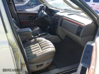 2004 Jeep Grand Cherokee Limited with VIN 1J8GW58N74C380204, listed as a IAAI auction lot 41756657 with 239,697 mi miles. Bid and sale history available at carsss.com. Image 5.