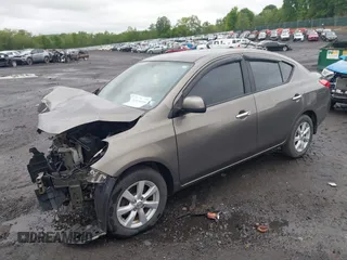 2012 Nissan Versa SV with VIN 3N1CN7AP3CL860116, listed as a IAAI auction lot 42329920 with 105,447 mi miles and . Bid and sale history available at DreamBid. Image 2.
