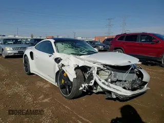 2015 Porsche 911 Turbo S with VIN WP0AD2A9XFS160370, listed as a Copart auction lot 77165054 with 19,235 mi miles and Salvage Title. Bid and sale history available at DreamBid. Image 10.