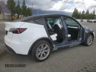 2023 Tesla Model Y Long Range z VIN 7SAYGDEE3PF916132, wystawiony jako Copart lot #51645625 z przebiegiem 28 238 mil mil oraz Szkoda całkowita • Salvage title. Historia ofert i sprzedaży dostępna na DreamBid. Obrazek 3.