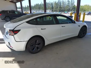 2023 Tesla Model 3 with VIN 5YJ3E1EA5PF610431, listed as a IAAI auction lot 42087181 with 19,777 mi miles and . Bid and sale history available at carsss.com. Image 4.