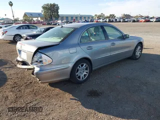 2005 Mercedes-Benz E-Class 3.2L with VIN WDBUF65J05A646577, listed as a IAAI auction lot 41666861 with 106,012 mi miles. Bid and sale history available at carsss.com. Image 4.
