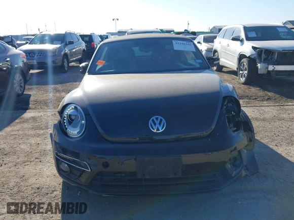 2014 Volkswagen Beetle 1.8T with VIN 3VW517AT4EM815243, listed as a IAAI auction lot 41245346 with 119,259 mi miles and . Bid and sale history available at DreamBid. Image 12.