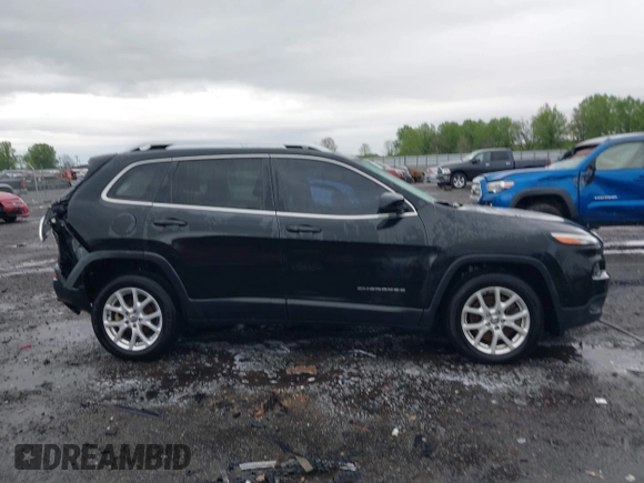 2015 Jeep Cherokee Latitude with VIN 1C4PJLCB0FW676917, listed as a IAAI auction lot 41928270 with 181,134 mi miles and . Bid and sale history available at carsss.com. Image 13.