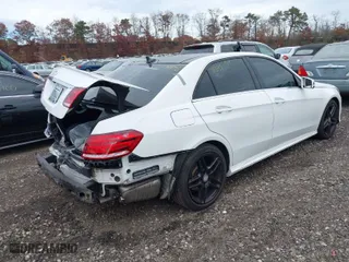 2015 Mercedes-Benz E-Class E 350 Luxury with VIN WDDHF8JB7FB163506, listed as a IAAI auction lot 40734709 with 87,059 mi miles. Bid and sale history available at carsss.com. Image 4.