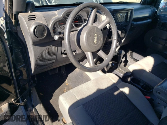 2010 Jeep Wrangler Rubicon with VIN 1J4BA6D10AL203265, listed as a Copart auction lot 79570754 with 114,840 mi miles and Salvage title. Bid and sale history available at DreamBid. Image 8.