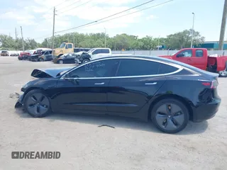 2020 Tesla Model 3 Standard Range Plus z VIN 5YJ3E1EA9LF738102, wystawiony jako IAAI lot #42107744 z przebiegiem 73 294 mil mil oraz . Historia ofert i sprzedaży dostępna na DreamBid. Obrazek 15.