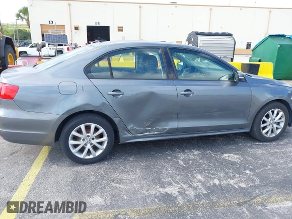 2011 Volkswagen Jetta Sedan SE w/Convenience & Sunroof with VIN 3VWDX7AJ9BM306477, listed as a IAAI auction lot 42144071 with 139,970 mi miles. Bid and sale history available at carsss.com. Image 6.