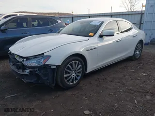 2014 Maserati Ghibli S Q4 with VIN ZAM57RTA1E1096387, listed as a IAAI auction lot 41424049 with 100,970 mi miles. Bid and sale history available at carsss.com. Image 2.