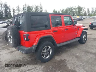 2018 Jeep Wrangler Unlimited Sahara with VIN 1C4HJXEG1JW310817, listed as a IAAI auction lot 42248374 with 64,516 mi miles and . Bid and sale history available at DreamBid. Image 4.