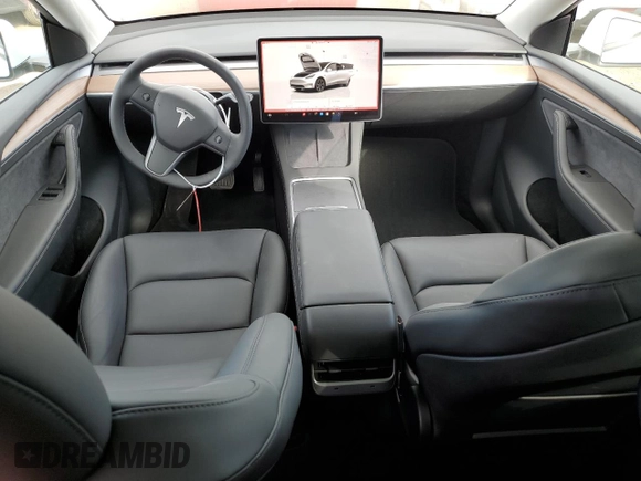 2025 Tesla Model Y Long Range with VIN 7SAYGDED6SF271931, listed as a Copart auction lot 43376015 with 261 mi miles and Salvage Title. Bid and sale history available at DreamBid. Image 8.