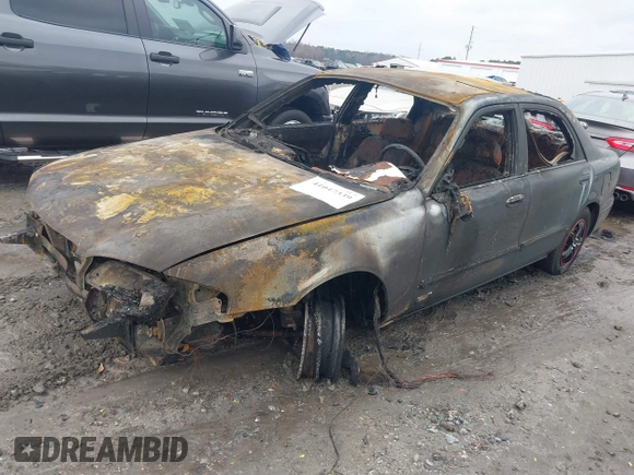 1999 Mazda 626 ES z VIN 1YVGF22C1X5840702, wystawiony jako IAAI lot #41047339 z przebiegiem Nie podano mil oraz . Historia ofert i sprzedaży dostępna na DreamBid. Obrazek 2.