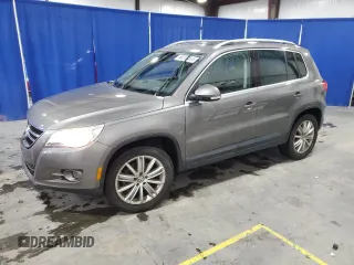 2011 Volkswagen Tiguan SE with VIN WVGAV7AXXBW516999, listed as a Copart auction lot 60240395 with 127,872 mi miles and Salvage title. Bid and sale history available at DreamBid. Image 1.