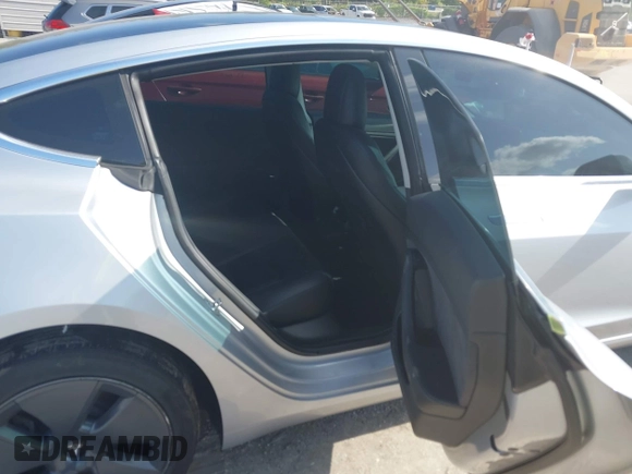 2018 Tesla Model 3 Long Range Battery with VIN 5YJ3E1EB7JF104356, listed as a IAAI auction lot 41936961 with 90,932 mi miles and . Bid and sale history available at DreamBid. Image 8.