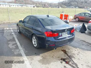 2013 BMW 3 Series 320i with VIN WBA3B1C58DK129051, listed as a IAAI auction lot 41119380 with 101,427 mi miles. Bid and sale history available at carsss.com. Image 3.