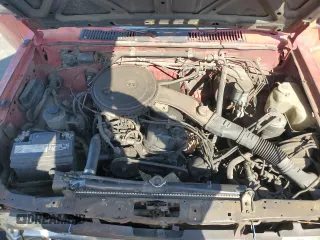 1987 Nissan Hardbody E z VIN JN6ND11S3HW006235, wystawiony jako Copart lot #78528914 z przebiegiem 298 079 mil mil oraz Szkody całkowita. Historia ofert i sprzedaży dostępna na DreamBid. Obrazek 11.