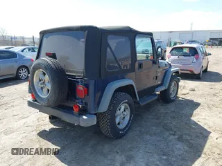 2000 Jeep Wrangler Sport with VIN 1J4FA49S7YP736479, listed as a IAAI auction lot 42042493 with 271,220 mi miles. Bid and sale history available at carsss.com. Image 4.