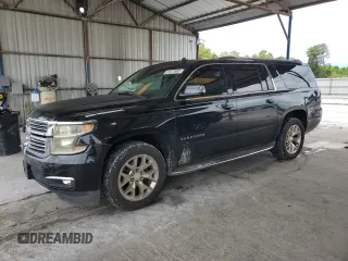 2015 Chevrolet Suburban LTZ with VIN 1GNSCKKC8FR199460, listed as a Copart auction lot 61821685 with 135,256 mi miles and Salvage title. Bid and sale history available at DreamBid. Image 1.