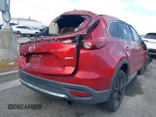 2016 Mazda CX-9 Grand Touring with VIN JM3TCADY0G0107481, listed as a IAAI auction lot 42043612 with Not Provided miles and . Bid and sale history available at DreamBid. Image 4.