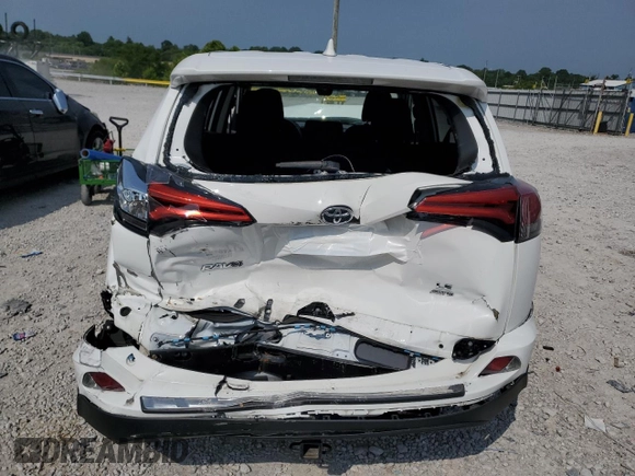 2018 Toyota RAV4 LE with VIN 2T3BFREV2JW780824, listed as a Copart auction lot 60258635 with 59,030 mi miles and Salvage title. Bid and sale history available at DreamBid. Image 6.