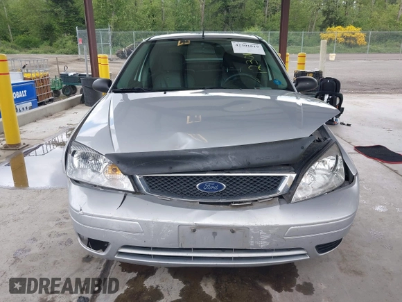 2006 Ford Focus S z VIN 1FAFP34N66W141597, wystawiony jako IAAI lot #42301819 z przebiegiem 94 705 mil mil oraz . Historia ofert i sprzedaży dostępna na DreamBid. Obrazek 13.