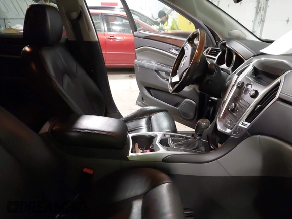 2011 Cadillac SRX Performance Collection with VIN 3GYFNEEY9BS533994, listed as a IAAI auction lot 40990072 with 168,134 mi miles. Bid and sale history available at carsss.com. Image 5.