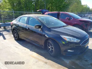2016 Ford Focus SE z VIN 1FADP3F23GL374480, wystawiony jako IAAI lot #42033633 z przebiegiem 75 743 mil mil oraz . Historia ofert i sprzedaży dostępna na DreamBid. Obrazek 1.
