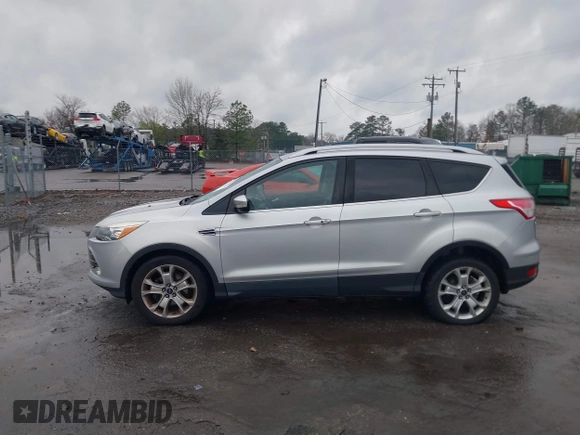 2016 Ford Escape Titanium with VIN 1FMCU0JX7GUB25573, listed as a IAAI auction lot 41871980 with 157,525 mi miles. Bid and sale history available at carsss.com. Image 14.