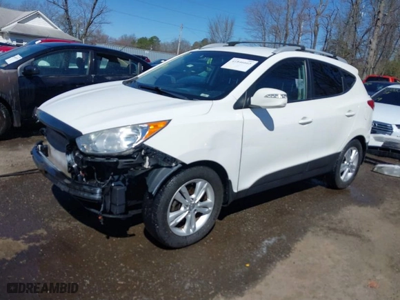 2013 Hyundai Tucson GLS with VIN KM8JU3AC6DU646866, listed as a IAAI auction lot 41846665 with 156,779 mi miles. Bid and sale history available at carsss.com. Image 2.