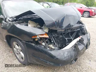 2002 Pontiac Bonneville SLE z VIN 1G2HY54KX24177224, wystawiony jako IAAI lot #42268134 z przebiegiem 107 935 mil mil oraz . Historia ofert i sprzedaży dostępna na DreamBid. Obrazek 18.