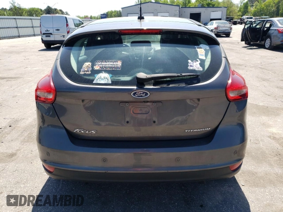 2016 Ford Focus Titanium with VIN 1FADP3N27GL201482, listed as a Copart auction lot 51768335 with 54,463 mi miles and Salvage title. Bid and sale history available at DreamBid. Image 6.