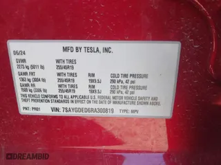 2024 Tesla Model Y with VIN 7SAYGDED6RA300819, listed as a IAAI auction lot 41769635 with 11,812 mi miles. Bid and sale history available at carsss.com. Image 9.