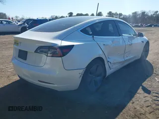 2020 Tesla Model 3 Standard Range Plus with VIN 5YJ3E1EA0LF783672, listed as a IAAI auction lot 41903431 with 52,157 mi miles and . Bid and sale history available at carsss.com. Image 4.