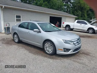 2012 Ford Fusion Hybrid z VIN 3FADP0L35CR268555, wystawiony jako IAAI lot #42740854 z przebiegiem 178 714 mil mil oraz . Historia ofert i sprzedaży dostępna na DreamBid. Obrazek 1.