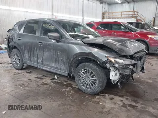 2020 Mazda CX-5 Touring with VIN JM3KFBCM0L0843242, listed as a IAAI auction lot 41536075 with 31,849 mi miles. Bid and sale history available at carsss.com. Image 1.