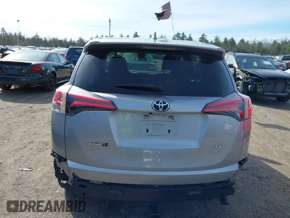 2018 Toyota RAV4 LE with VIN JTMBFREV8JJ224872, listed as a IAAI auction lot 41907962 with 104,605 mi miles and . Bid and sale history available at DreamBid. Image 16.