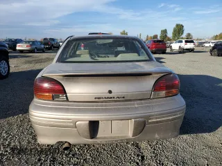 1996 Pontiac Grand Am SE2 with VIN 1G2NE52T3TC834038, listed as a Copart auction lot 76610794 with 140,379 mi miles and Salvage Title. Bid and sale history available at carsss.com. Image 6.