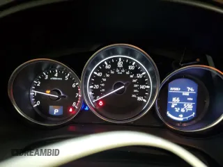 2016 Mazda CX-5 Touring z VIN JM3KE4CY5G0852073, wystawiony jako Copart lot #56599055 z przebiegiem 72 167 mil mil oraz Szkoda całkowita • Salvage title. Historia ofert i sprzedaży dostępna na DreamBid. Obrazek 9.